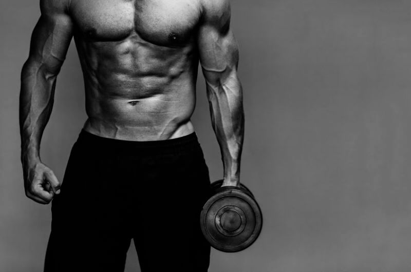 man holding dumbbell