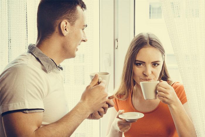 man and woman enjoying tea