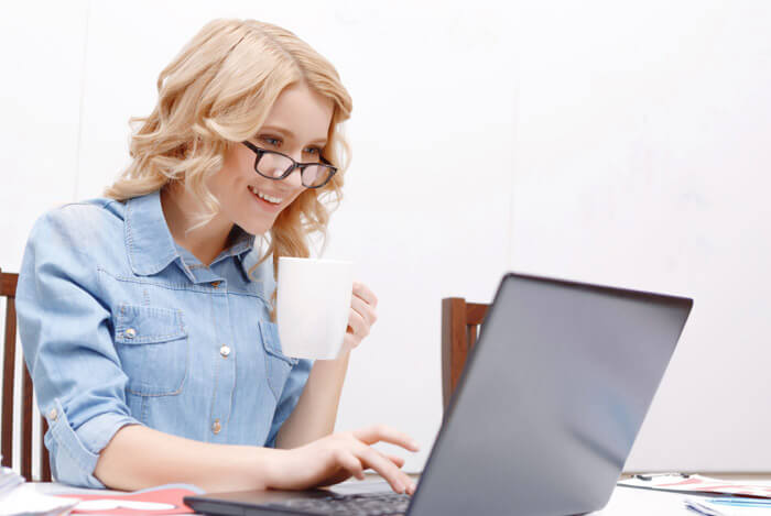 smart woman working drinking tea