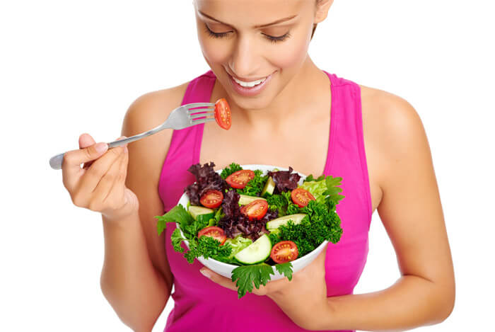 woman eating salad