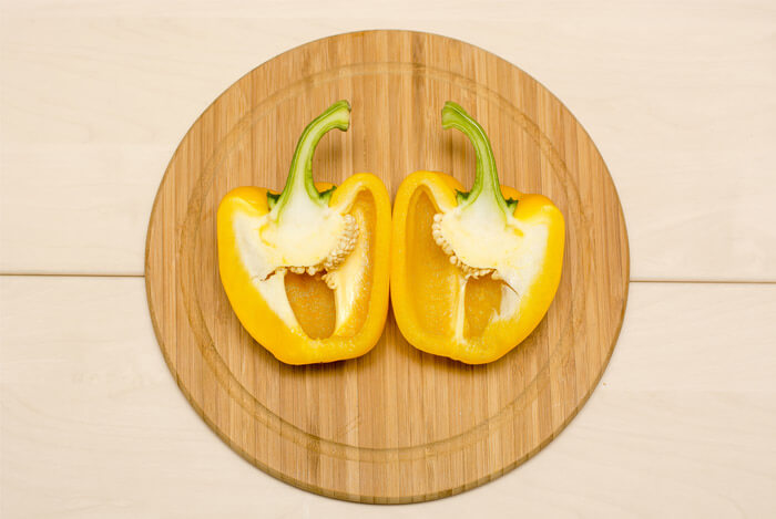 yellow peppers cut board