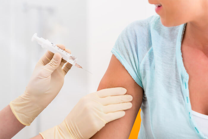 woman getting a vaccine