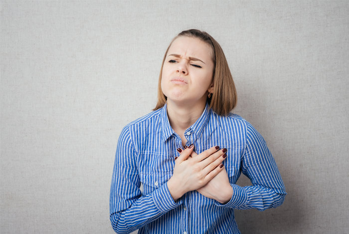 woman with heartburn
