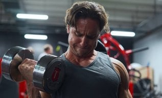 Are Standing Or Seated Biceps Curls Better for Arm Growth?