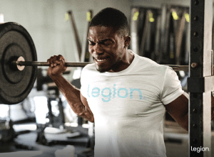 Male athlete squatting after taking the best pre-workout for weight loss