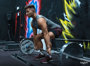 Male athlete deadlifting in the gym, illustrating how much deadlifting you should do for size and strength.
