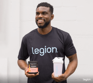 Athlete evaluating pre workout vs creatine supplements before a workout.