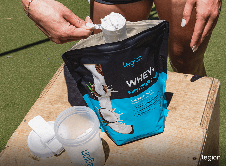 Female making a protein shake, which is a good supplement for helping get rid of mom butt.