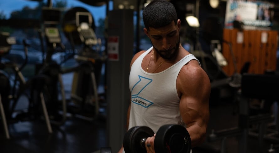 Athlete doing biceps curls as part of a back and biceps workout