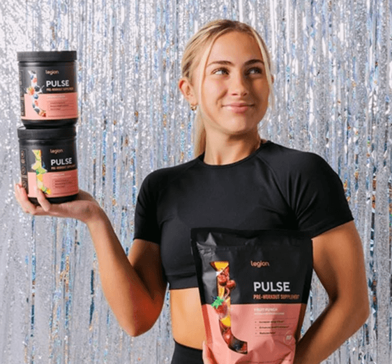 Woman drinking from a Legion shaker bottle