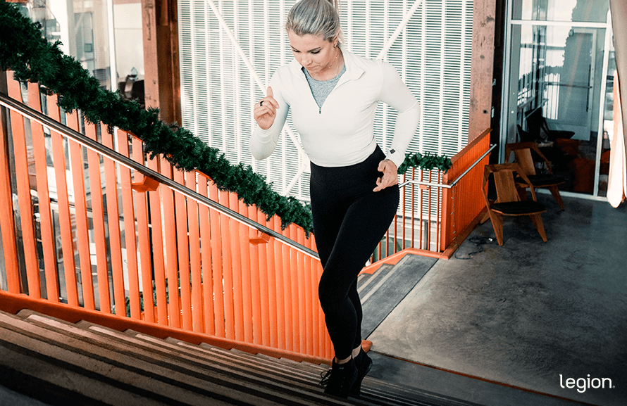 Female Legion Athlete Running Up Stairs