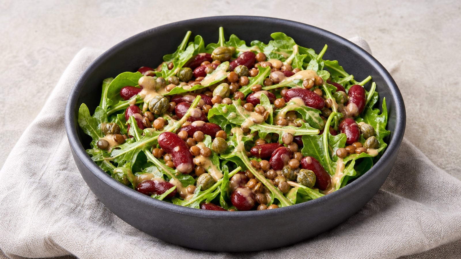 Kidney bean and lentil salad with arugula and tahini dressing