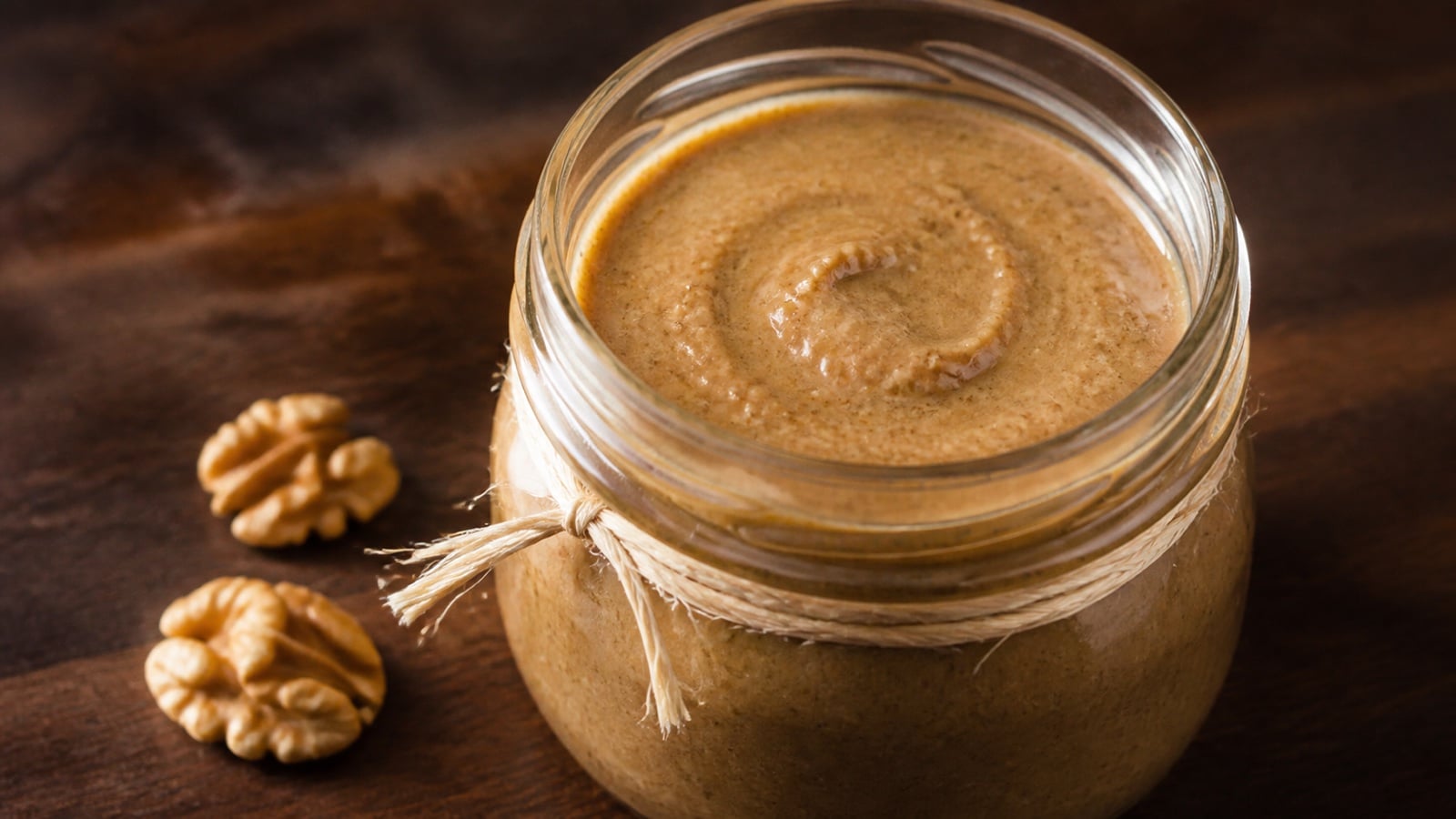 Spiced walnut butter in a clear glass jar
