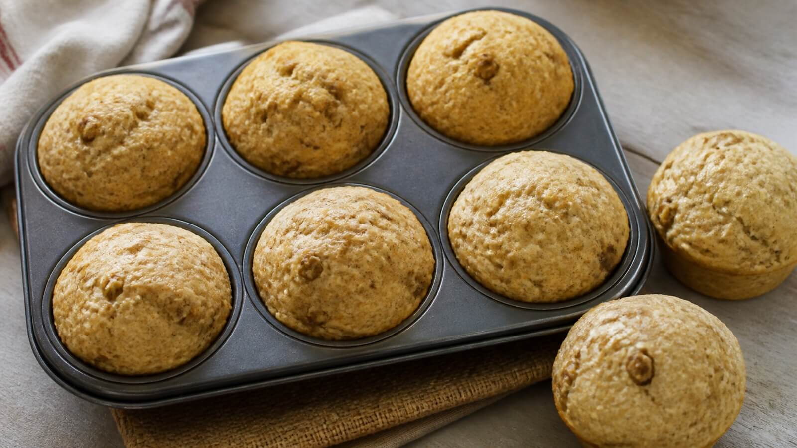 Whole-wheat pancake sausage muffins in a muffin pan