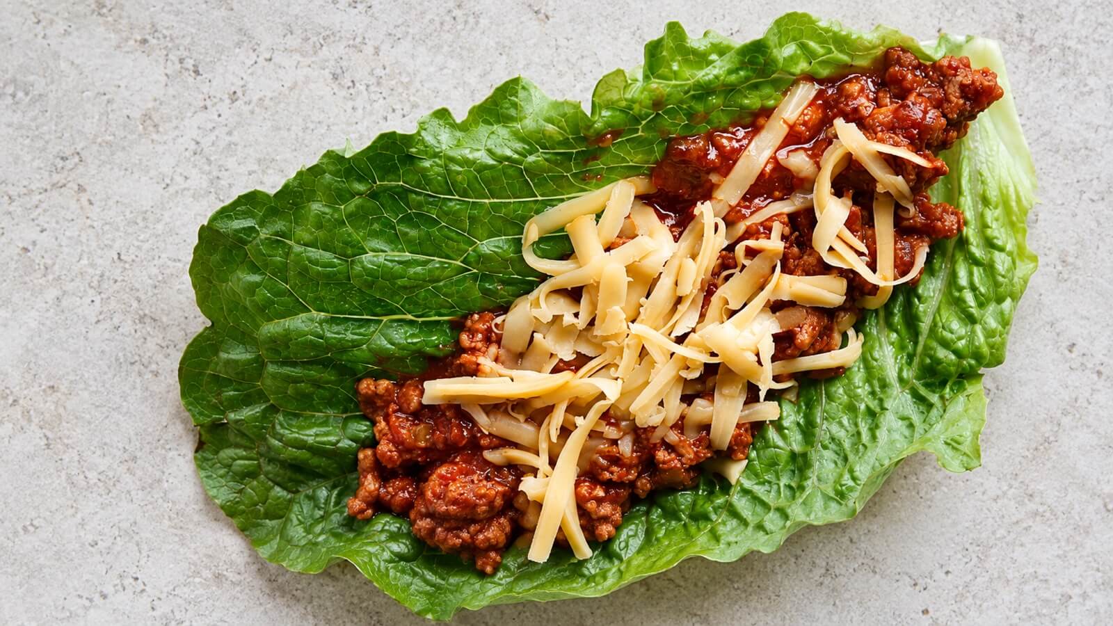 Turkey sloppy joe and cheddar in a romaine lettuce leaf