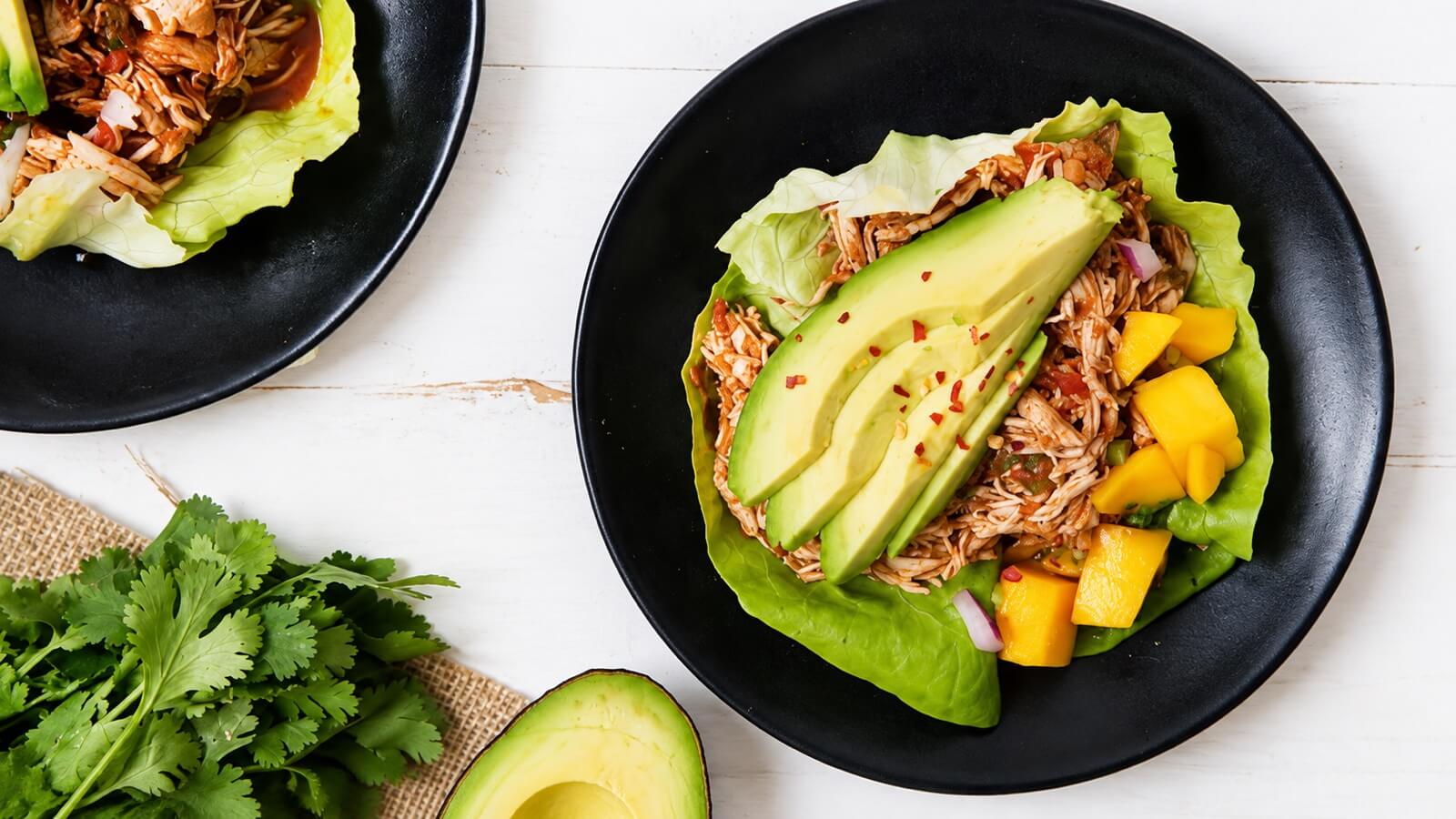 Mango chicken lettuce wraps with avocado and mango