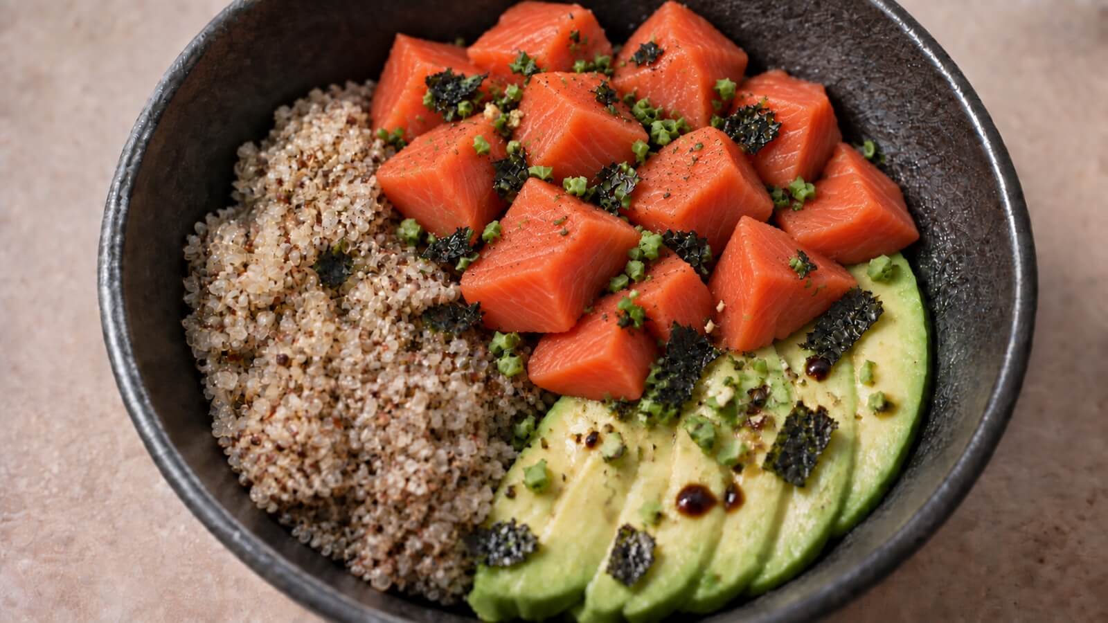 Spicy salmon sushi bowl with quinoa and avocado